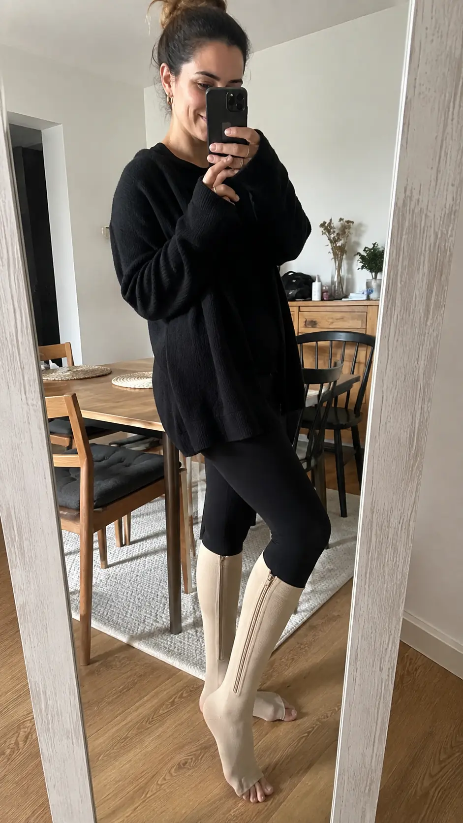 Customer wearing beige Easy Zip Compression Socks at home