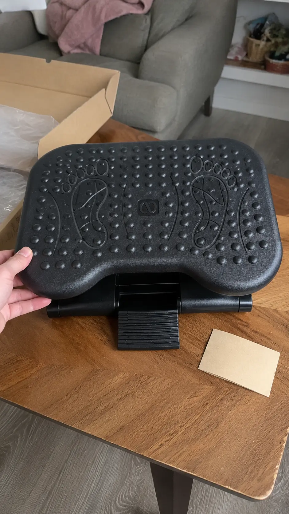 Ergonomic Footrest unboxed on a wooden table