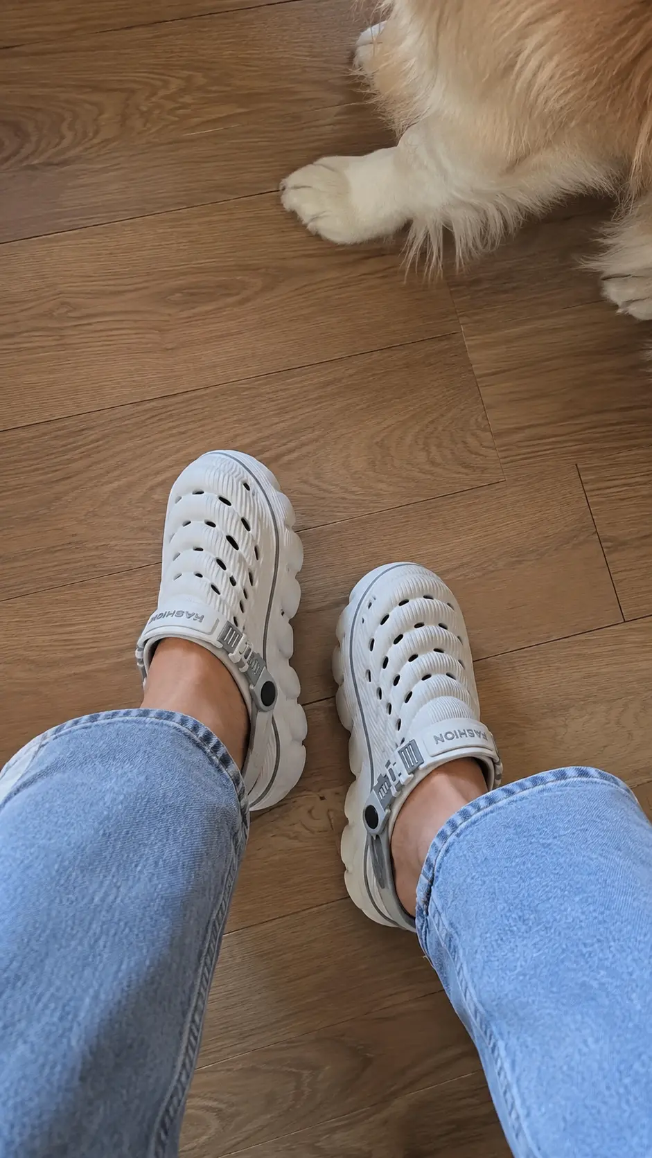 Cloud Recovery Slippers worn at home next to a dog