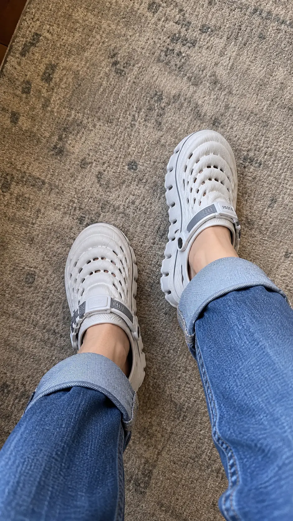White Cloud Recovery Slippers worn with rolled jeans