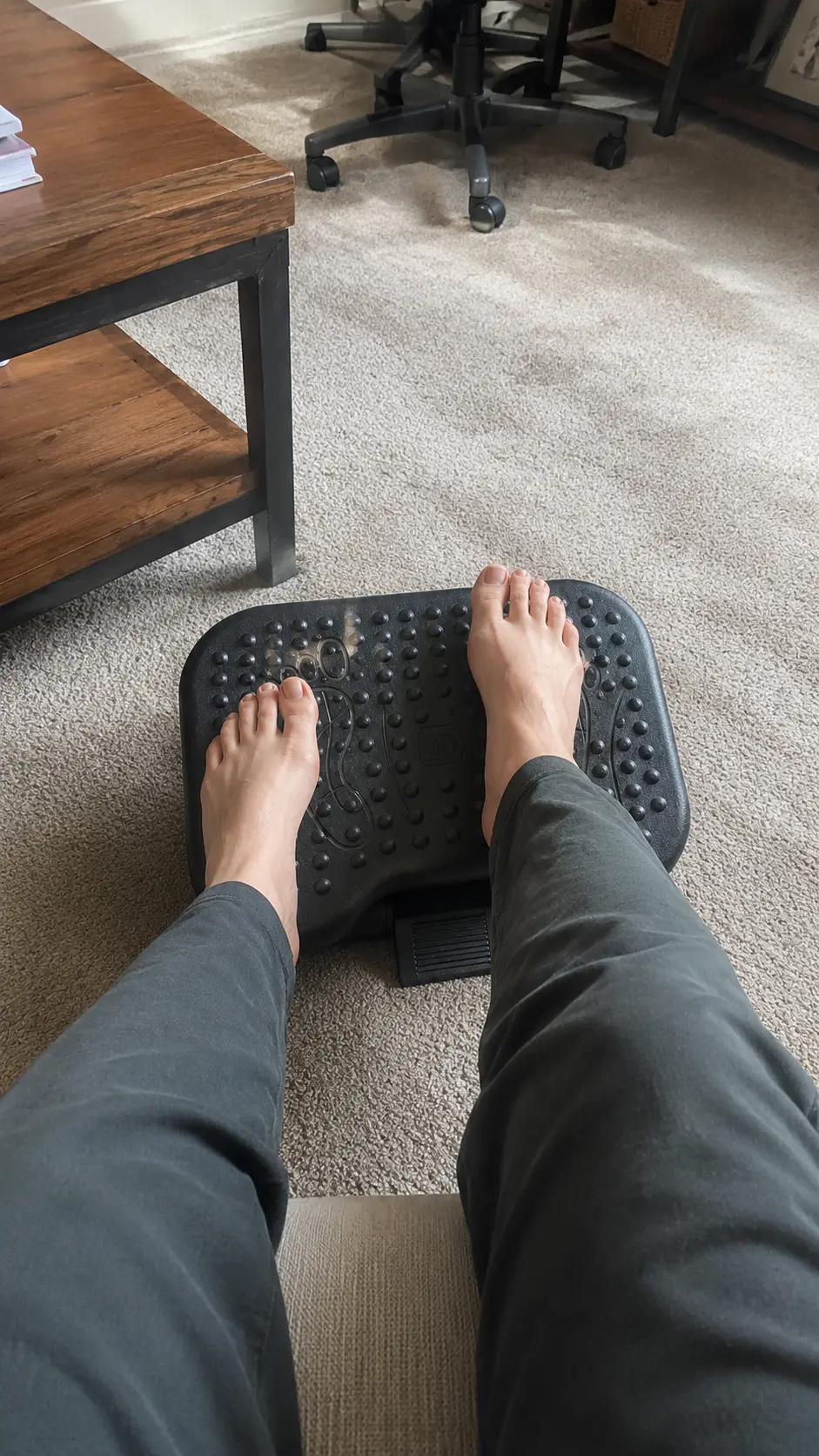 Bare feet on the textured surface of the Ergonomic Footrest