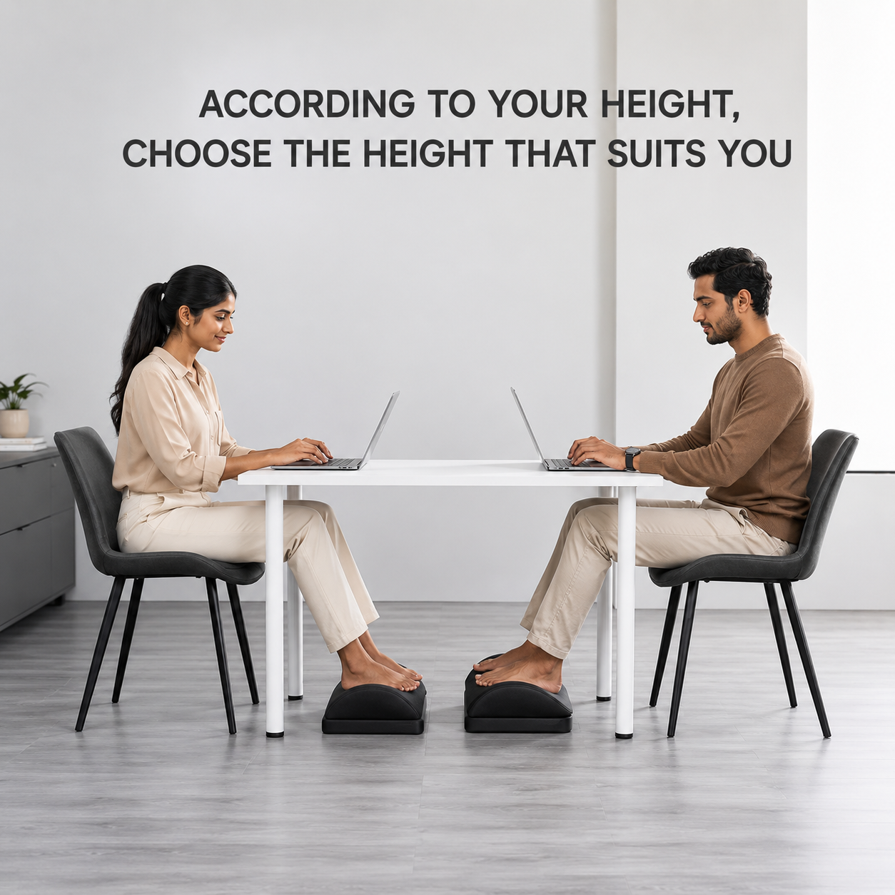 Two people using the curved footrest at a desk